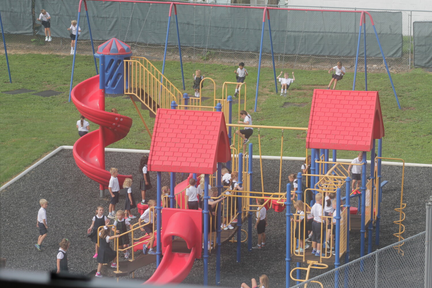 Children enjoy recess on their first day of school at Holy Family School in Hannibal.